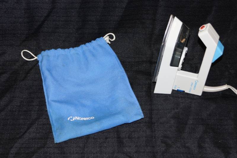lot 395 image: Vintage Norelco  SpraySteam Travel-Size Iron & Bag