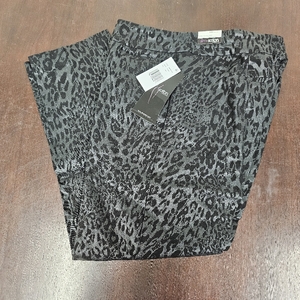 lot 1012 image: Slim-Sation by Multiples brand pants featuring a black and gray leopard print pattern. Size 14W