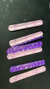 lot 10319 image: Pink and purple slap bracelets lot