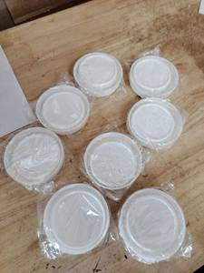 lot 2146 image: A 16 piece plastic Mason jar white big and small lids