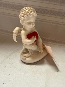 lot 25837 image: Baby Angel Holding a Heart