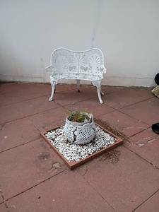 lot 892 image: Wrought Iron Decorative Bench with Plant Holder.   Bench 33 x 40 x 23.   Plant Holder 10 x 13