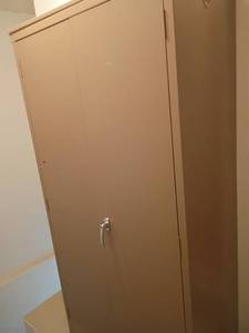 lot 948 image: Storage Cabinet.  Adjustable Shelves. Located at top of stairs to the basement , but right by back door. 72.5 x 36.5 x 18.5.