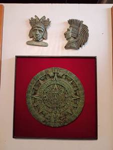 lot 960 image: Egyptian-Themed Decorative Figurines and Calendar Disk.  Figurines 6in. and Disk 16 x 16.  Located in basement