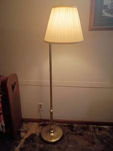 lot 971 image: Brass Floor Lamp.   57in tall.  Located in basement