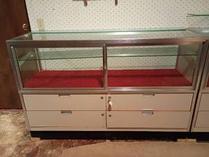 lot 1005 image: Display Cabinet with 4 Drawers.   39 x 60 x 20.   Located in basement