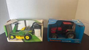 lot 1109 image: John Deere and Case IH Farm Toy Lot 2 Models Ride-On Tractor