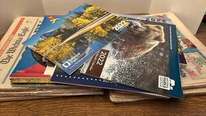 lot 1219 image: Mixed Wall Calendars & Newspapers �� National Parks, VFW, Three Stooges, Wichita Eagle, USA Today