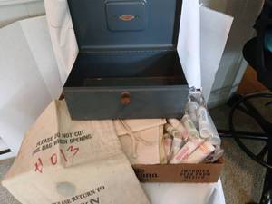 lot 1325 image: Bank box with key and cloth bank bags