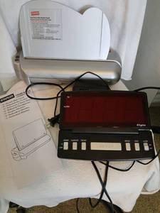 lot 1328 image: Staples electronic  hole punch and alarm clock