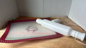 lot 1415 image: Silicone Pastry Brush with White Handle and Rope Loop with Pampered Chef Cutting Boards