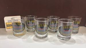 lot 1423 image: State Farm Charles Case Fire and Casualty Drinking Glasses Set of 6 with Coasters