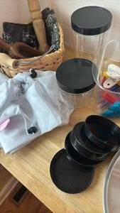 lot 1458 image: Mesh Bags, Clear Canisters, Grinder, Clips, Basket, Wooden Utensils