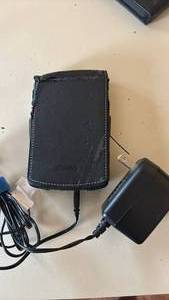 lot 1473 image: palmOne PDA Handheld Device with Leather Case and AC Adapter