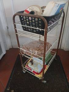 lot 1624 image: Four-Tier Wire Storage Basket Organizer with Handles and Wheels 25x16x11, with miscellaneous