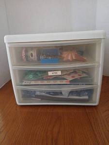 lot 1633 image: 3-Drawer Plastic Storage Organizer with eyelets and eyelet pliers,  buttons, and fabric.