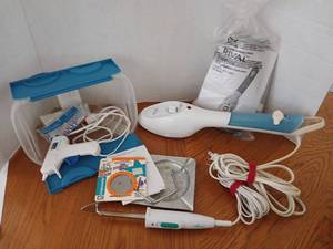 lot 1684 image: Rival Handheld Steamer Model MC-900 120V 60Hz 20W, hot glue gun