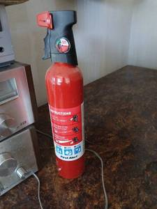 lot 1703 image: First Alert Fire Extinguisher and Discharge Nozzle