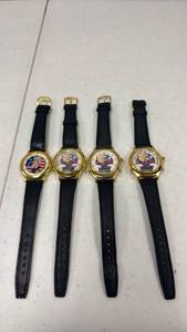 lot 1803 image: 4 Political Character Wristwatches Gold Tone Black Leather Straps