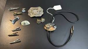 lot 1810 image: Bolo tie, belt buckle, tie clip and cuff links