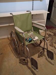 lot 3004 image: Futuro Wheelchair with Crutch Grips and Leg Extensions.   Wheelchair has a cracked side.  See pictures.  Located in basement