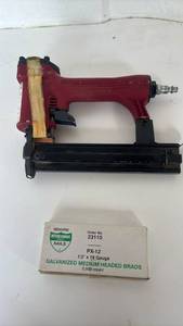 lot 4322 image: Pneumatic Brad Nailer with Interchangeable 12 x 18 Gauge Galvanized Medium Headed Brads 5000 Count