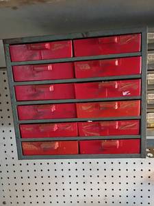 lot 4400 image: 12 Drawer Storage Bins with Contents.  Will need to remove from wall