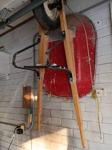 lot 4411 image: Wheelbarrow.   Will need to be removed from the wall