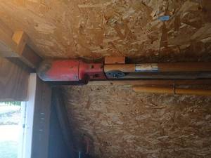 lot 5045 image: Post hole digger, and rake tool bring tools&nbsp