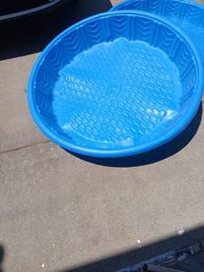 lot 5073 image: Blue Plastic Round Basin with Textured Bottom 2, one holds water the other has tear