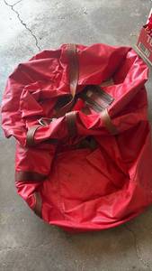 lot 4230 image: Red Nylon Duffel Bag with Brown Leather Straps and Handles qty 2 30 inches round and 19 deep