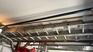 lot 4247 image: Werner 32ft Extension Ladder.  Located on ceiling in garage you��ll need to bring another ladder to get it down.