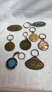 lot 135 image: Lot of 8 Aircraft Keychains & Boeing 747 KC-135 C-40 Medallions