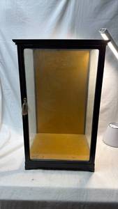 lot 232 image: Glass Display Cabinet with Black Plastic Trim and  Yellow Base