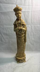 lot 13 image: Carved Resin Figurine Depicting Robed Figure with Crown and Beaded Necklace