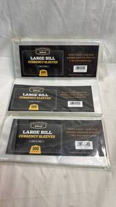 lot 49 image: Cardboard Gold Large Bill Currency Sleeves 7 916 x 3 516 100 Count Lot of 3 (1 appears half gone)