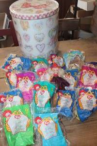 lot 1964 image: Tin with NIP McDonalds TY Beanie Babies & More