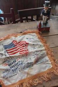 lot 2065 image: Vintage Cast Iron Uncle Sam Bank and More