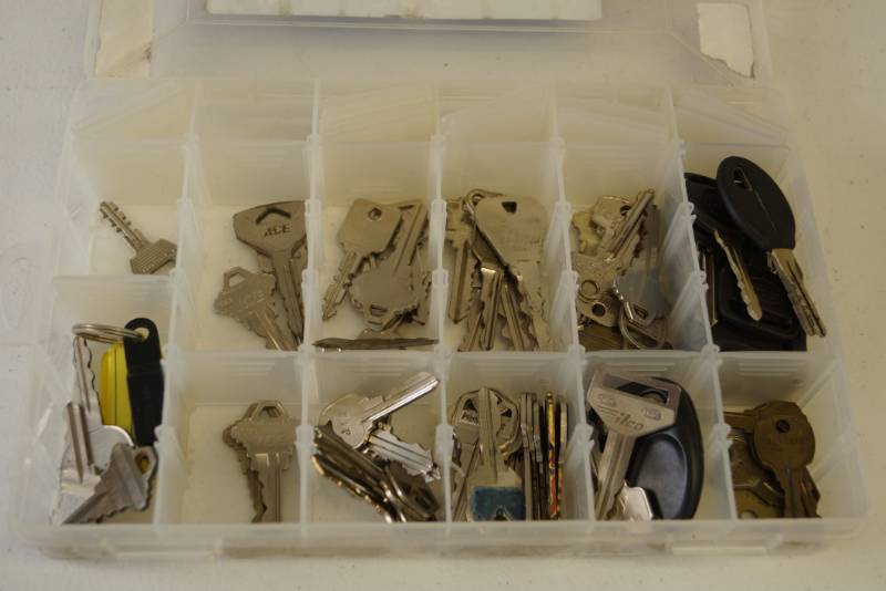 lot 63 image: Keys Keys Keys and Handy Plastic Case To Take Em Home