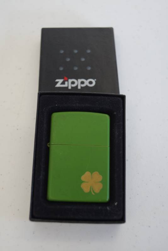lot 151 image: Green Zippo Lighter with Golden Shamrock