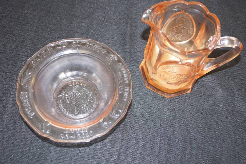 lot 162 image: Vintage Mother Goose Tiara Glass Pink Colored & Jack Jumped Over Candle Stick Cup 50s