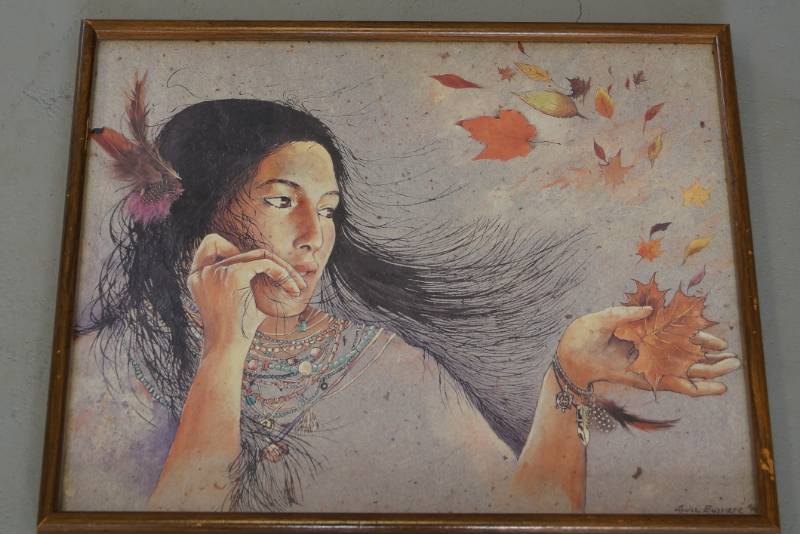 lot 185 image: Framed Native American Poster  Woman with Blowing Leaves  By Louise Bussiere