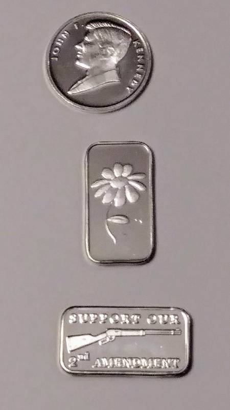 lot 245 image: Lot of 3  1 Gram .999 Silver  J.F. Kennedy, a Daisy Flower & Rifle