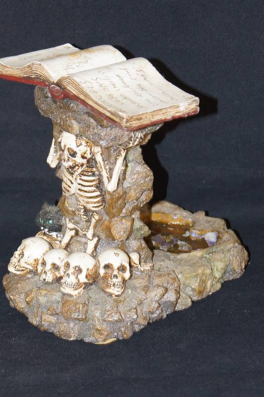 lot 302 image: Skeleton Themed Candle Holder-  Weird and Neat At The Same Time