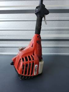 lot 230 image: Red String Trimmer with Black Shaft and Head - Incomplete Not Tested