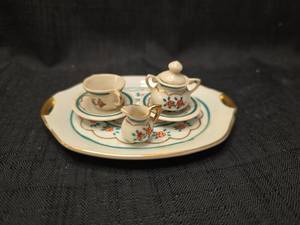 lot 1318 image: Miniature Porcelain Tea Set with Floral Decoration 7 Pieces