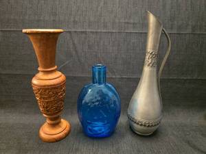 lot 2141 image: 3-Piece Decorative Lot Wooden Carved Vase, Blue Glass Bottle, Metal Pitcher