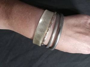lot 60313 image: Set of 4 Metal Bracelets with Textured and Decorative Finishes