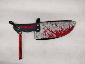 lot 58436 image: Spirit Halloween knife-shaped purse