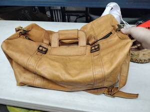 lot 58453 image: tan leather duffel bag